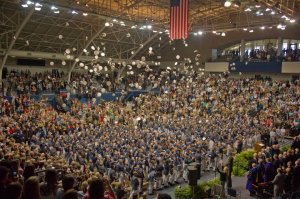 This photo taken at graduation shows the time honored tradition of tossing your cover in the air once the president dismisses the class. This photo could be taken in any year, but it is from May 2011.