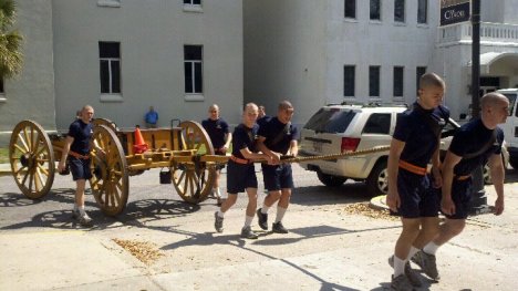 5th Battalion knobs pull the canons into the barracks after the parade.