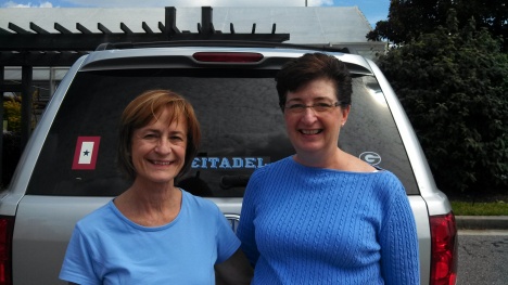 Karen Devine and Dorie stand by the back of the Devine's car for a photo.